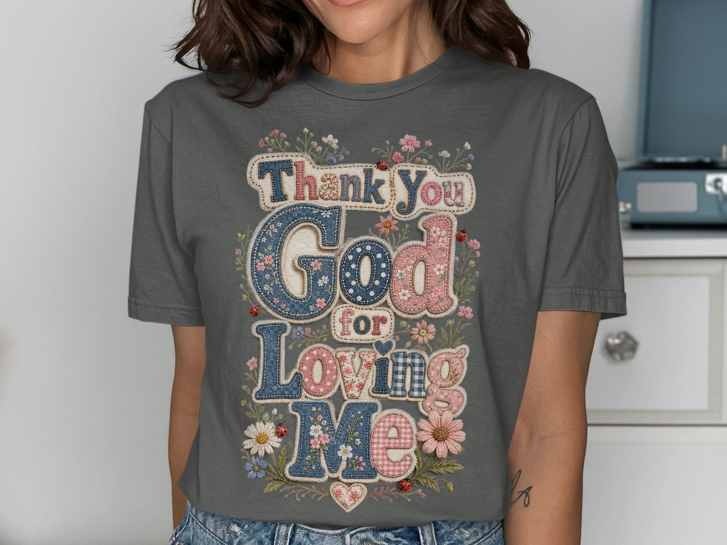 Gray t-shirt with "Thank You God For Loving Me" text and floral patchwork.