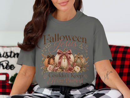 "Falloween Jesus Couldn't Keep Him Buried" text with pumpkins and floral design.