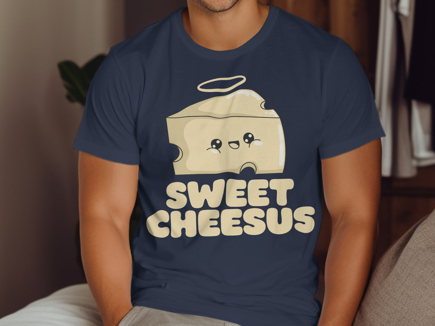 Cartoon wedge of cheese with halo and smiling face, text "Sweet Cheesus".