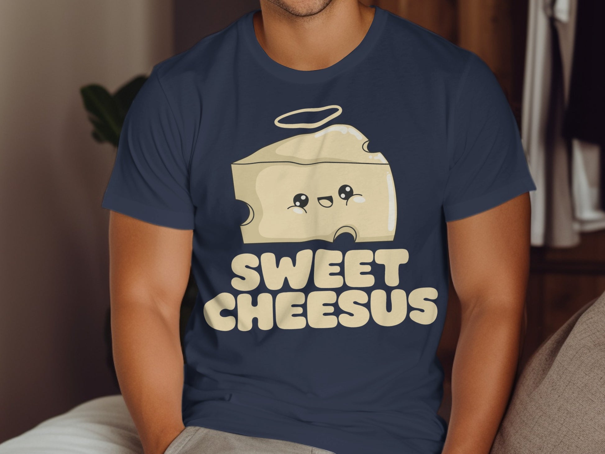 Cartoon wedge of cheese with halo and smiling face, text "Sweet Cheesus".