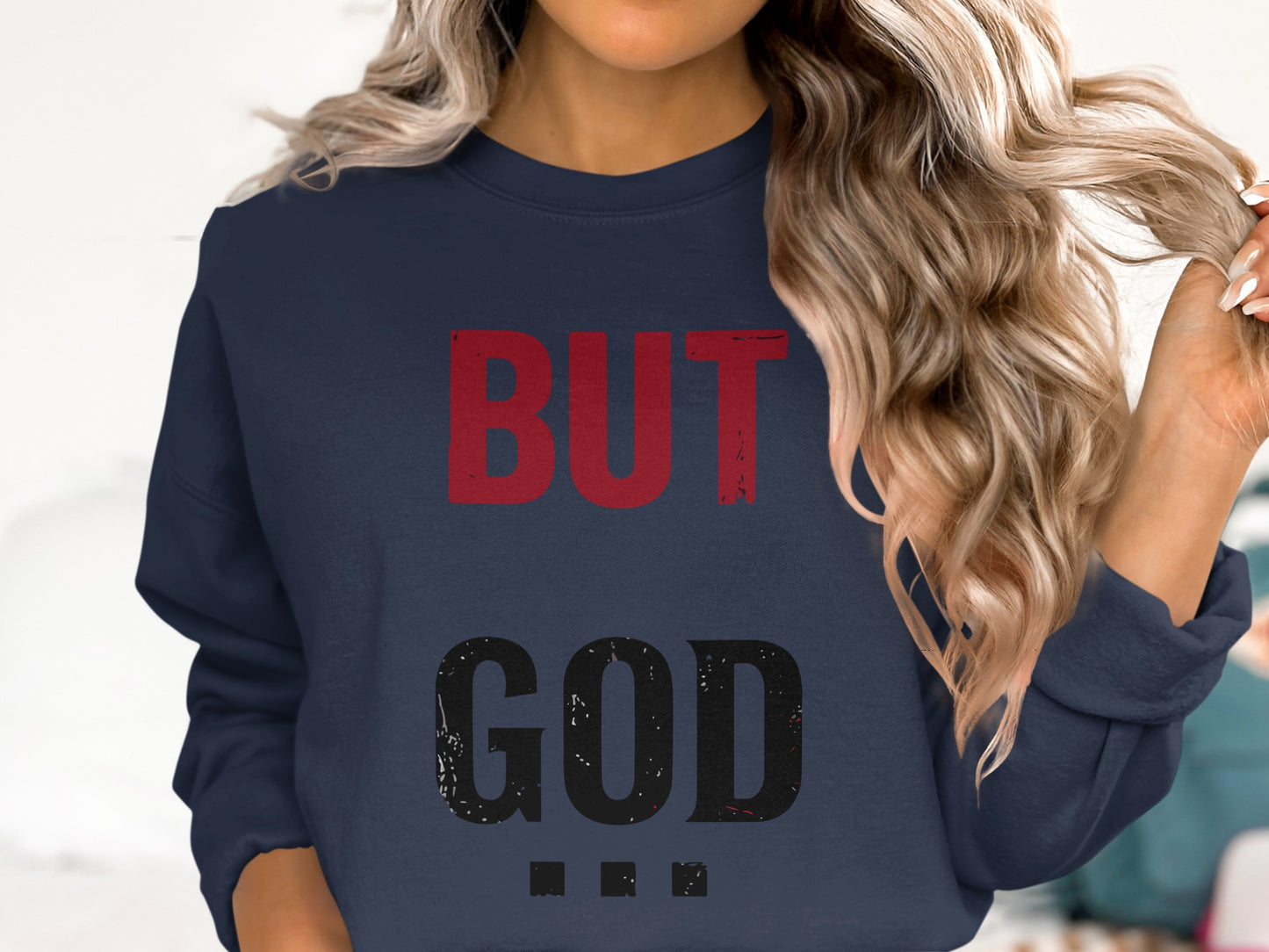 Navy sweatshirt with "BUT GOD" in distressed red and black text.