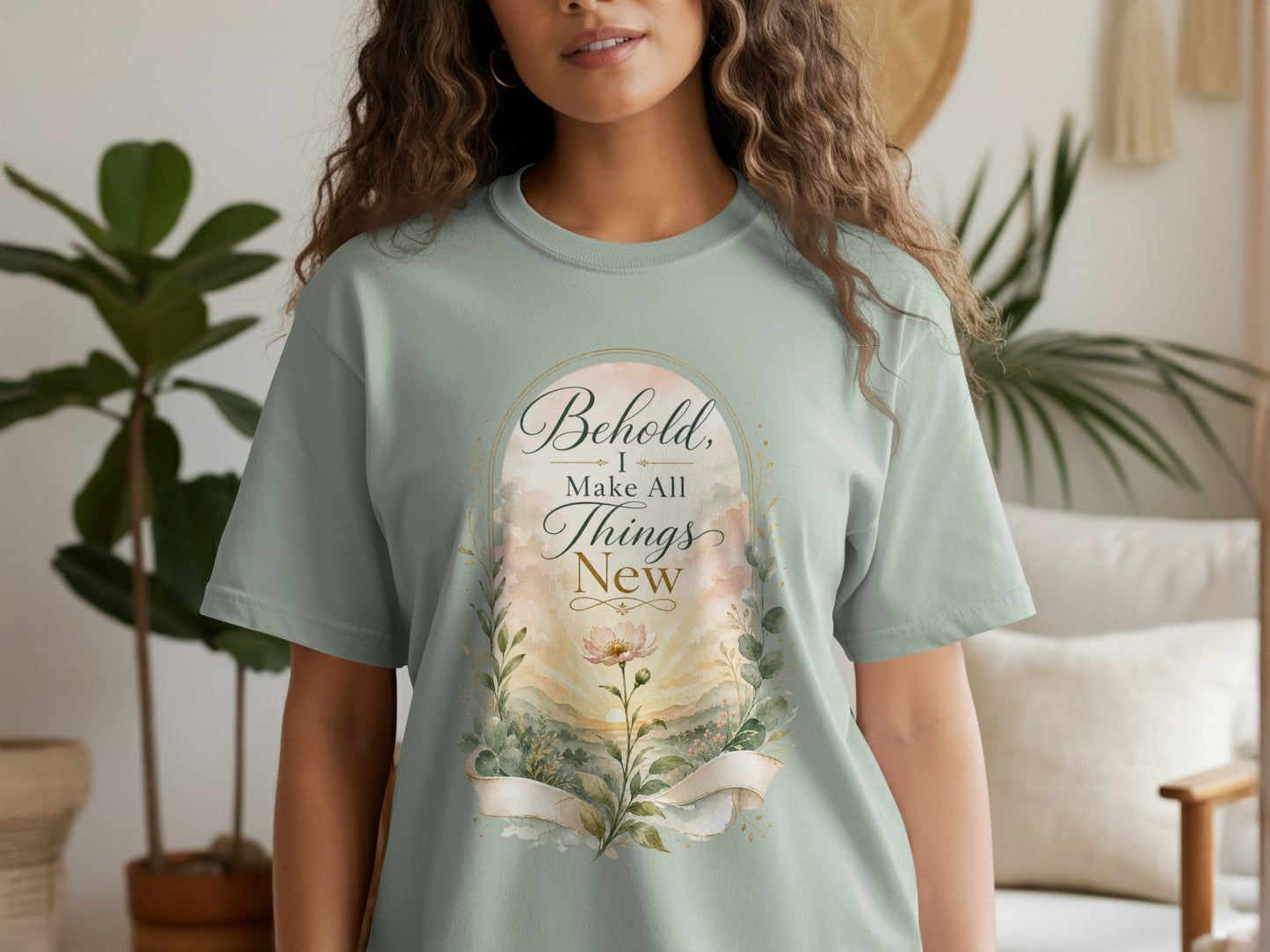 Light green t-shirt with "Behold, I Make All Things New" text and floral design.
