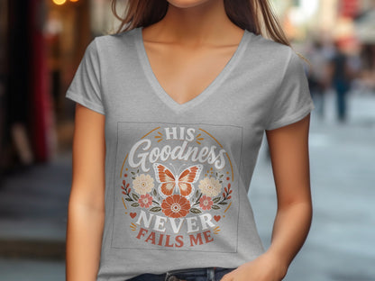 Grey v-neck t-shirt with butterfly and floral design, text reads "His Goodness Never Fails Me".