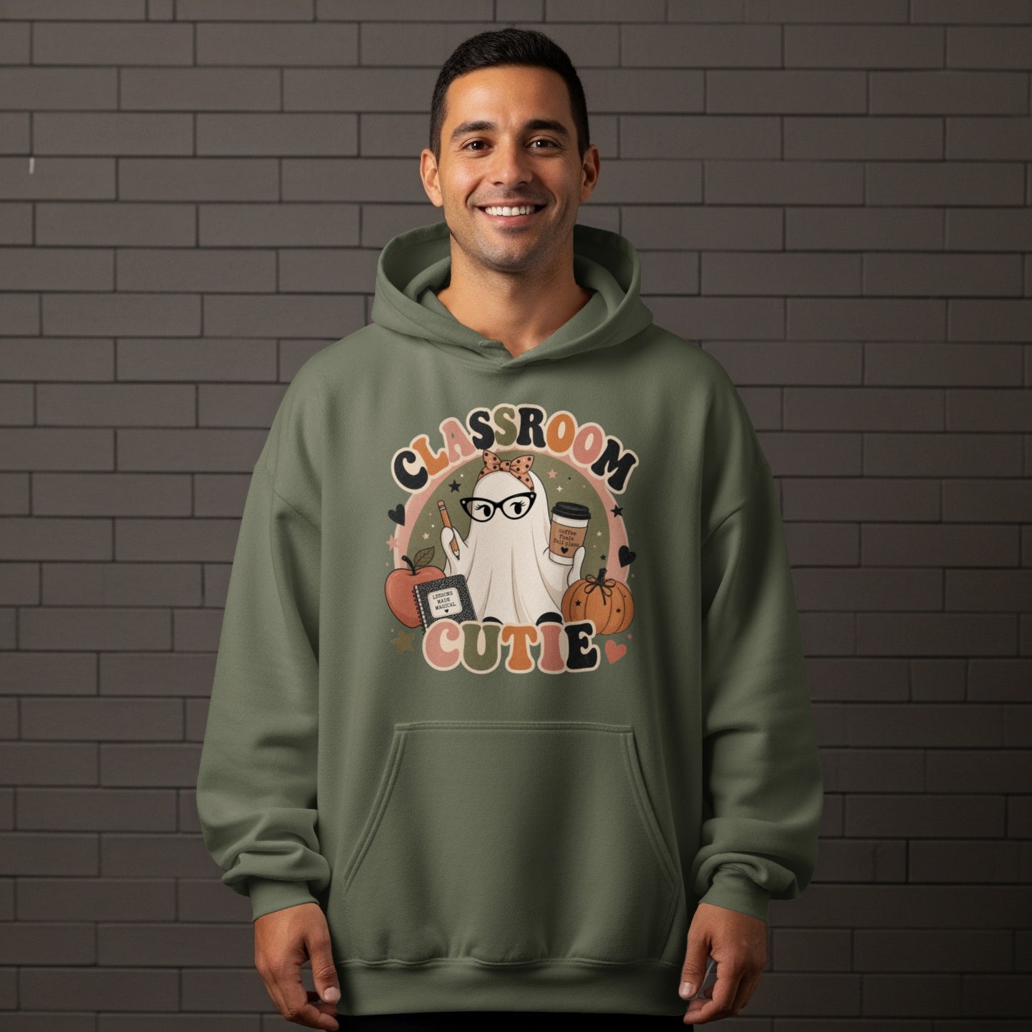 Ghost graphic with "Classroom Cutie" text, holding coffee and a pencil, with apple and pumpkin accents.