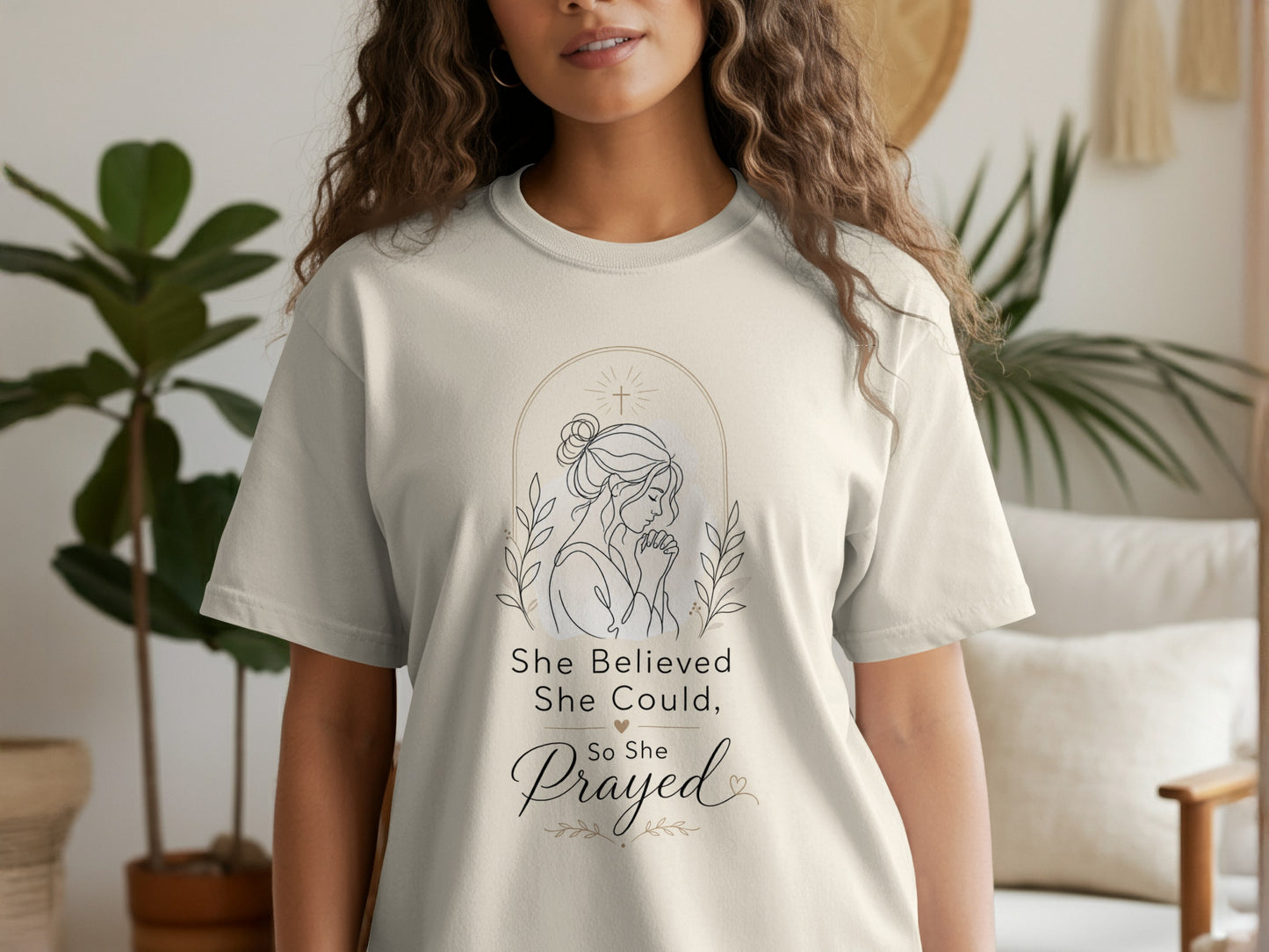 Cream t-shirt with line drawing of praying woman and text "She Believed She Could, So She Prayed."