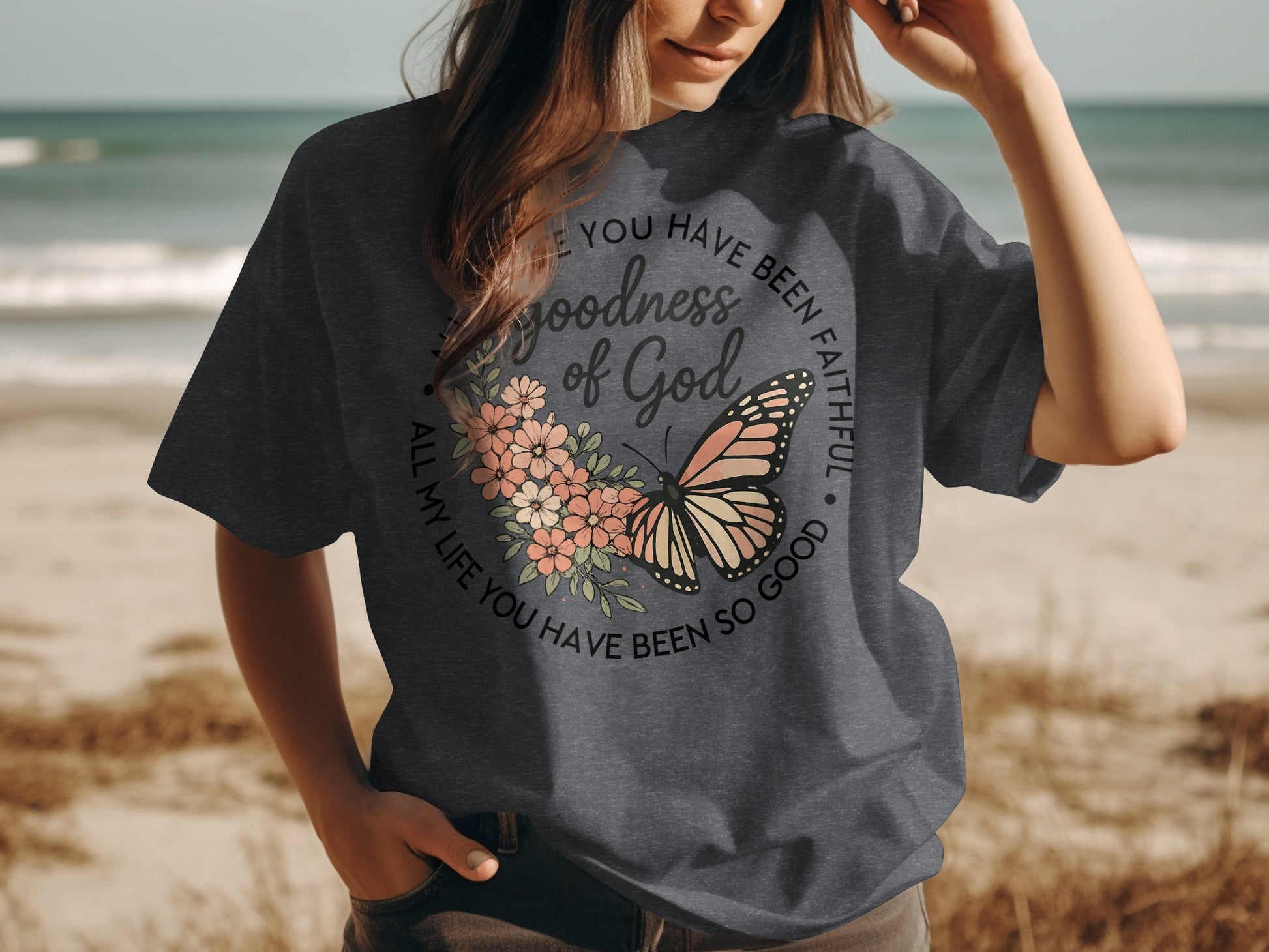 Dark gray t-shirt with "Goodness of God" and butterfly design.