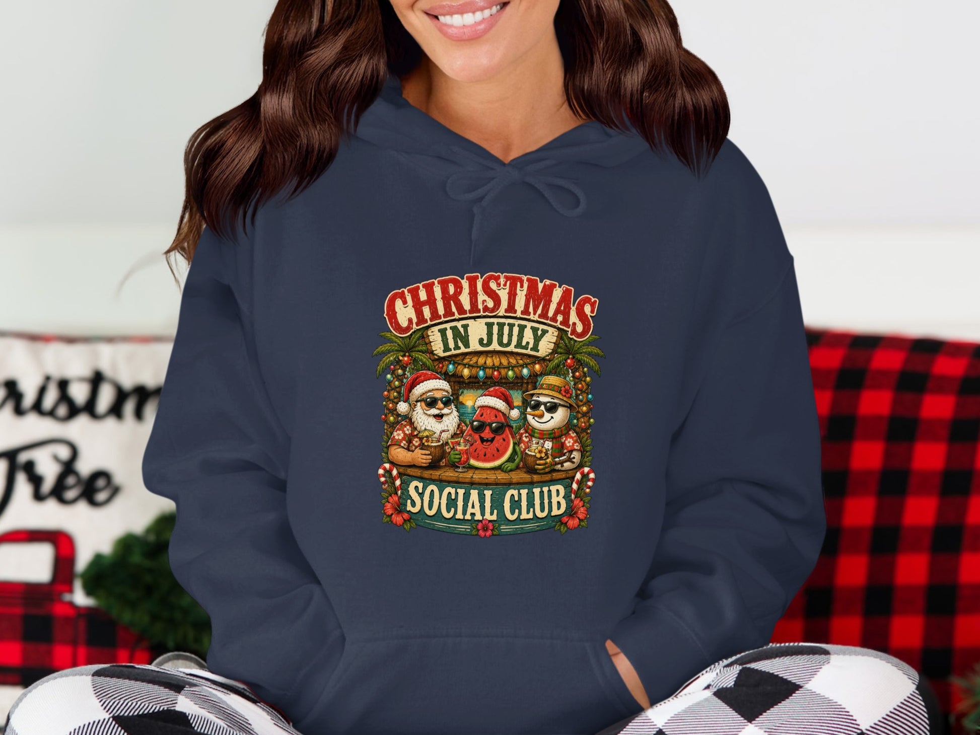 Navy hoodie featuring a Christmas Social Club graphic with Santa, snowman, and watermelon characters.