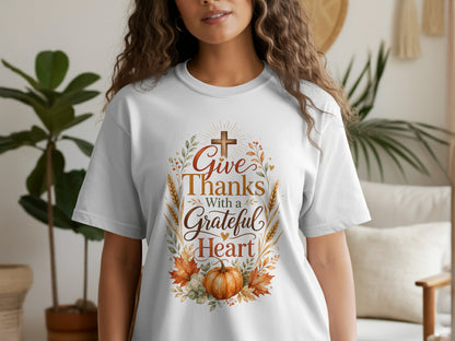 White t-shirt with "Give Thanks With a Grateful Heart" text and autumn graphics.