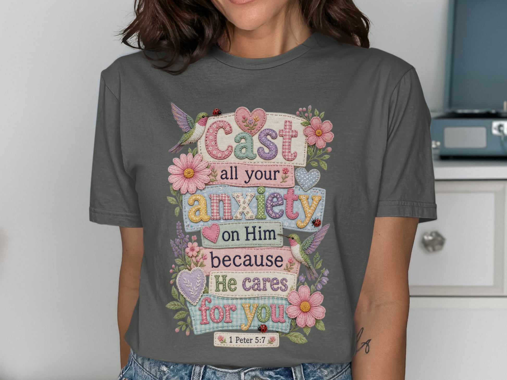 Grey t-shirt with "Cast all your anxiety on Him because He cares for you 1 Peter 5:7" text.