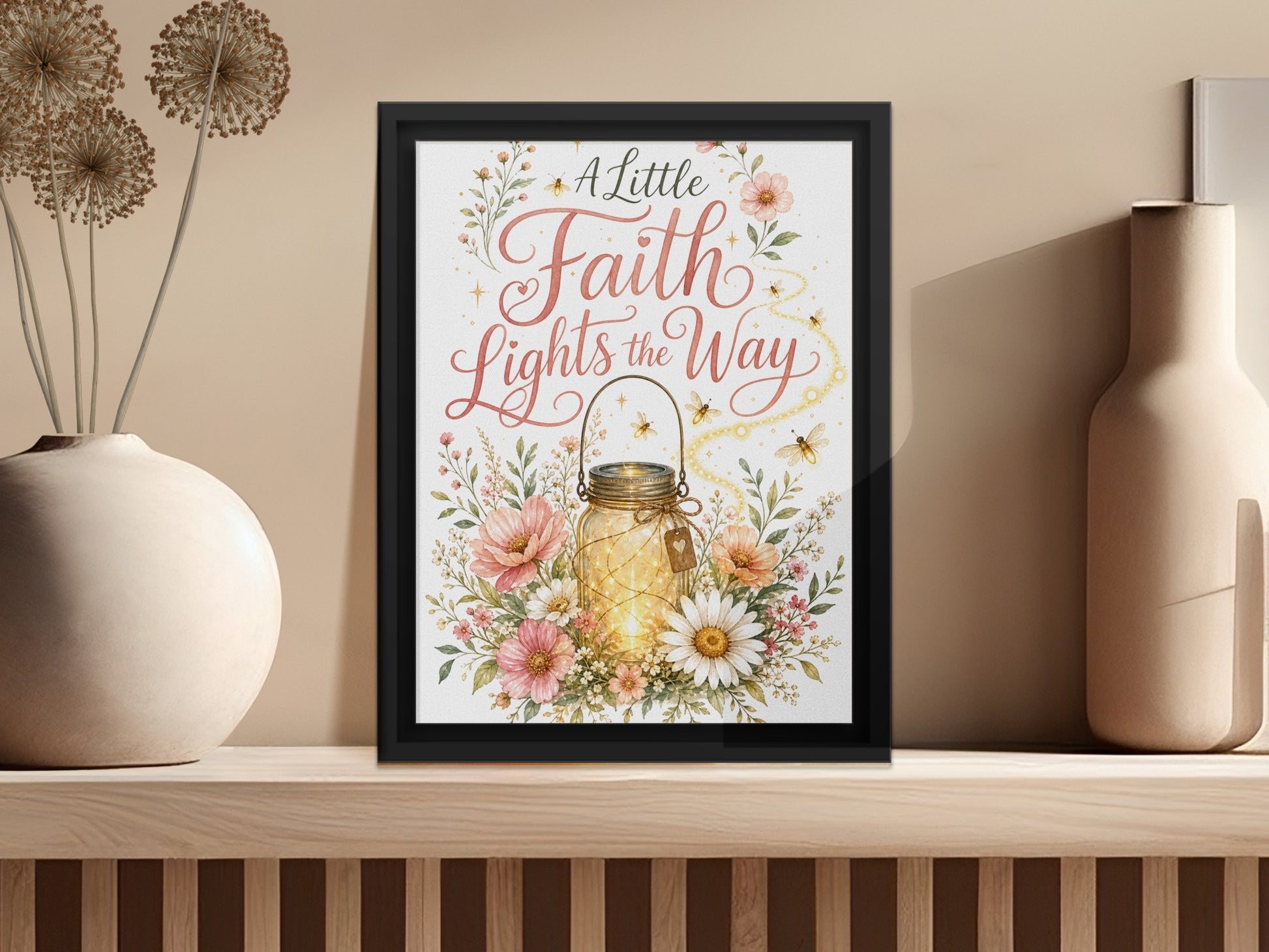 Framed artwork with "A Little Faith Lights the Way" quote and illuminated jar.