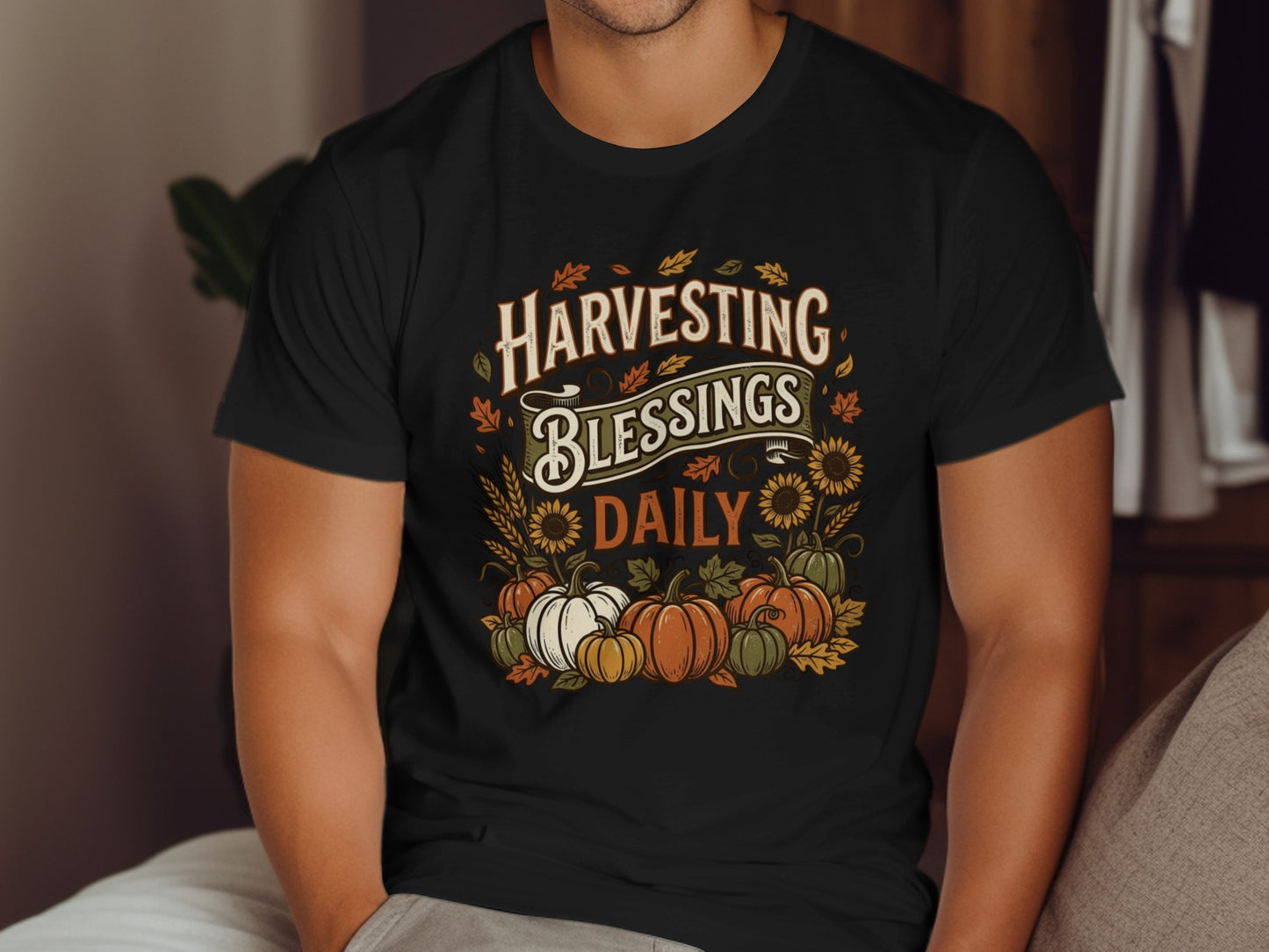 Black t-shirt with "Harvesting Blessings Daily" text, pumpkins, and sunflowers.