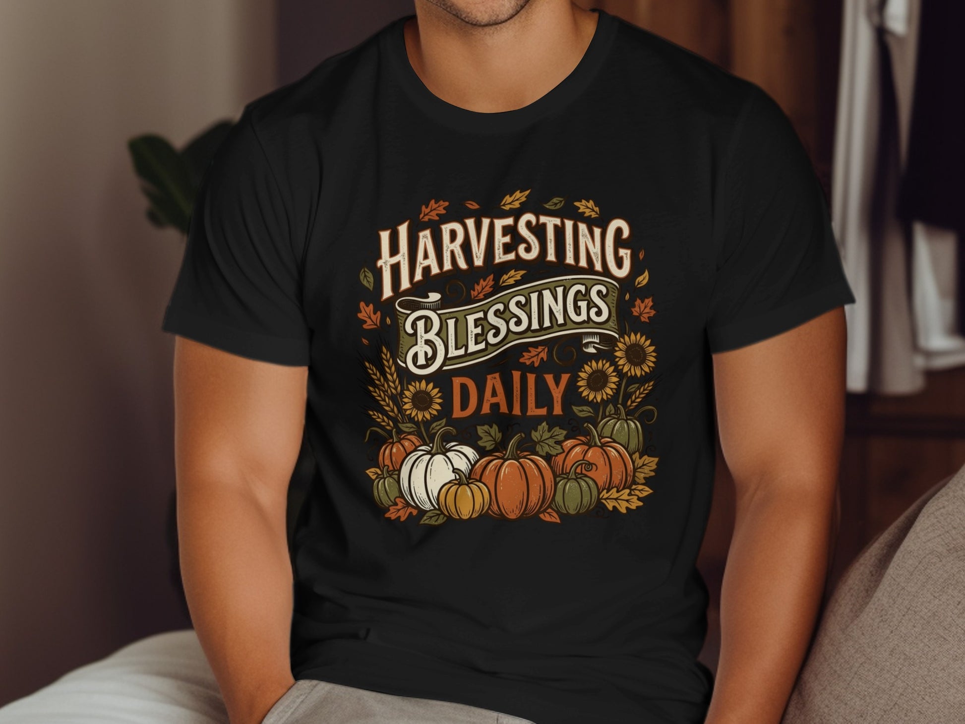 Black t-shirt with "Harvesting Blessings Daily" text, pumpkins, and sunflowers.