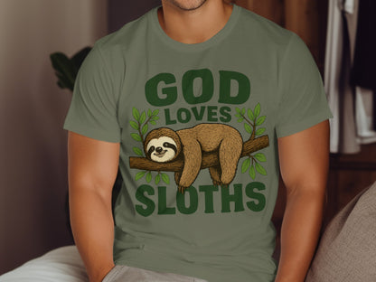 Green t-shirt with "God Loves Sloths" text and a sloth on a branch.