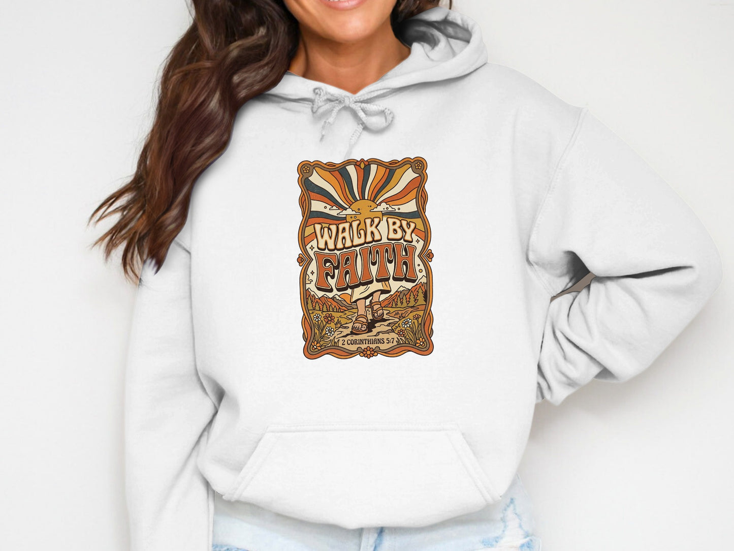 White hoodie with "Walk by Faith" graphic featuring a sun and landscape.