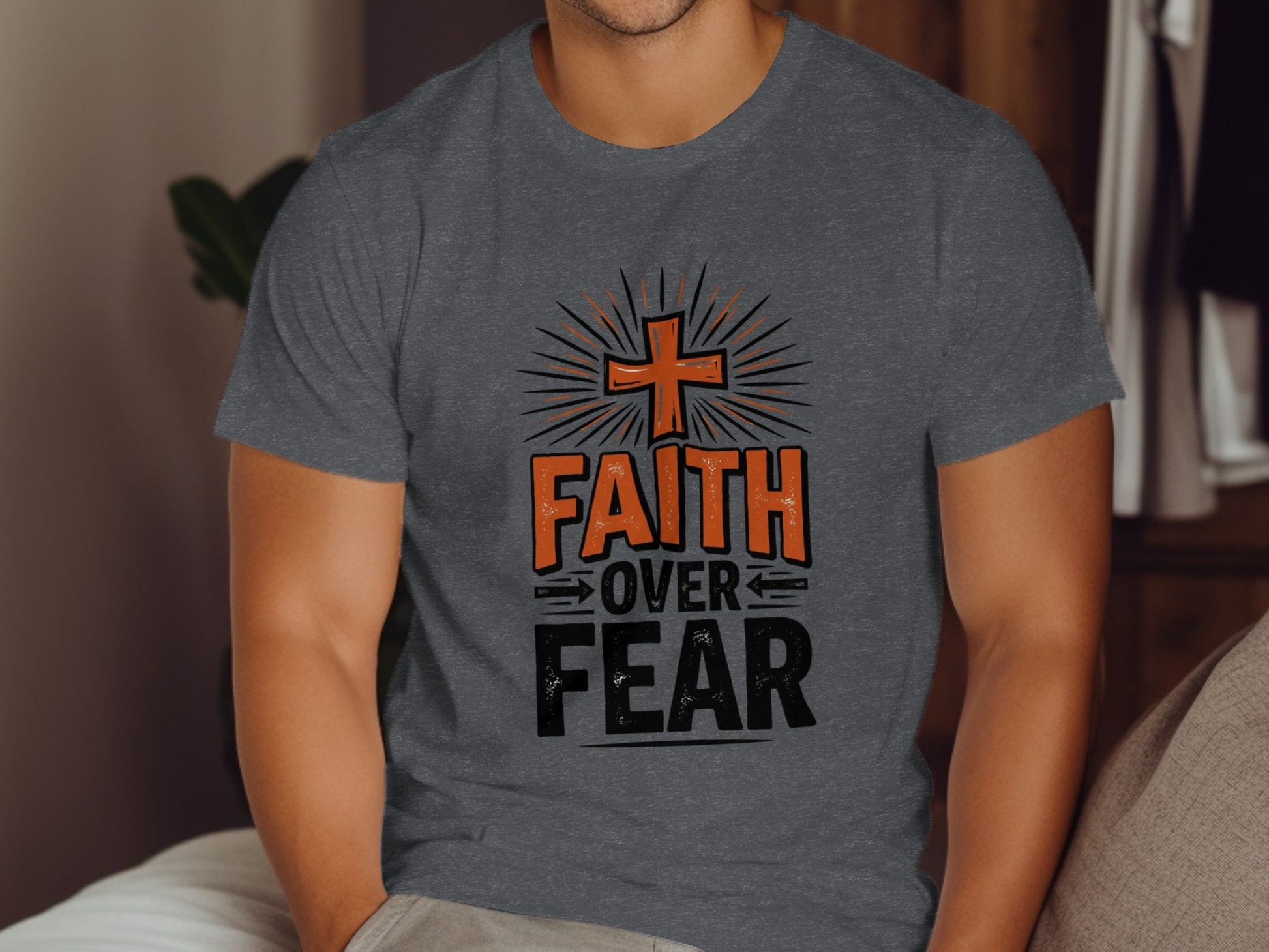 Dark gray t-shirt with "FAITH OVER FEAR" text and a cross design.