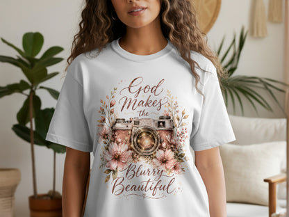 White t-shirt with floral camera graphic and text "God Makes the Blurry Beautiful".