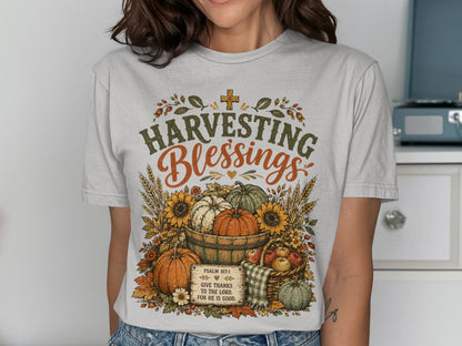T-shirt with "Harvesting Blessings" and Psalm 107:1 about giving thanks.