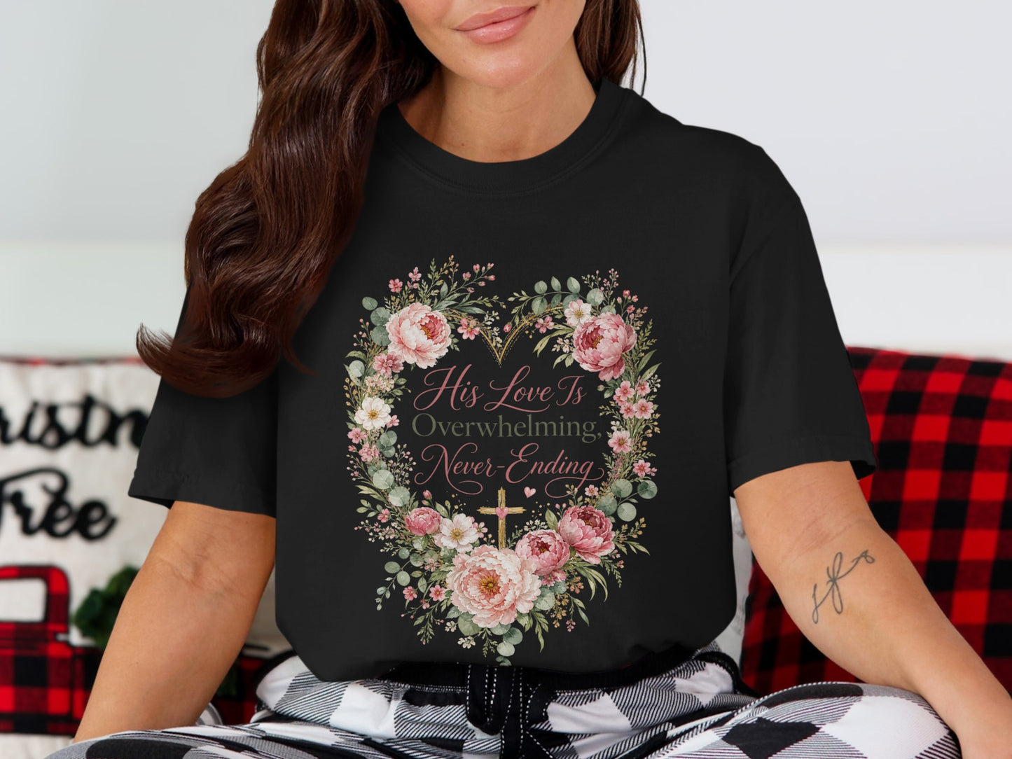 Black t-shirt with floral heart graphic and text "His Love Is Overwhelming, Never-Ending".