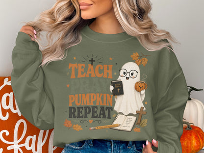 Ghost with glasses holding Bible and pumpkin mug; "Teach Pumpkin Repeat".