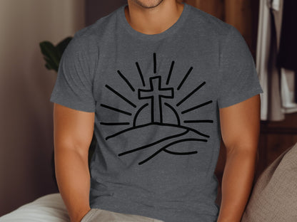 Dark grey t-shirt featuring a black line drawing of a cross on a hill with sun rays.