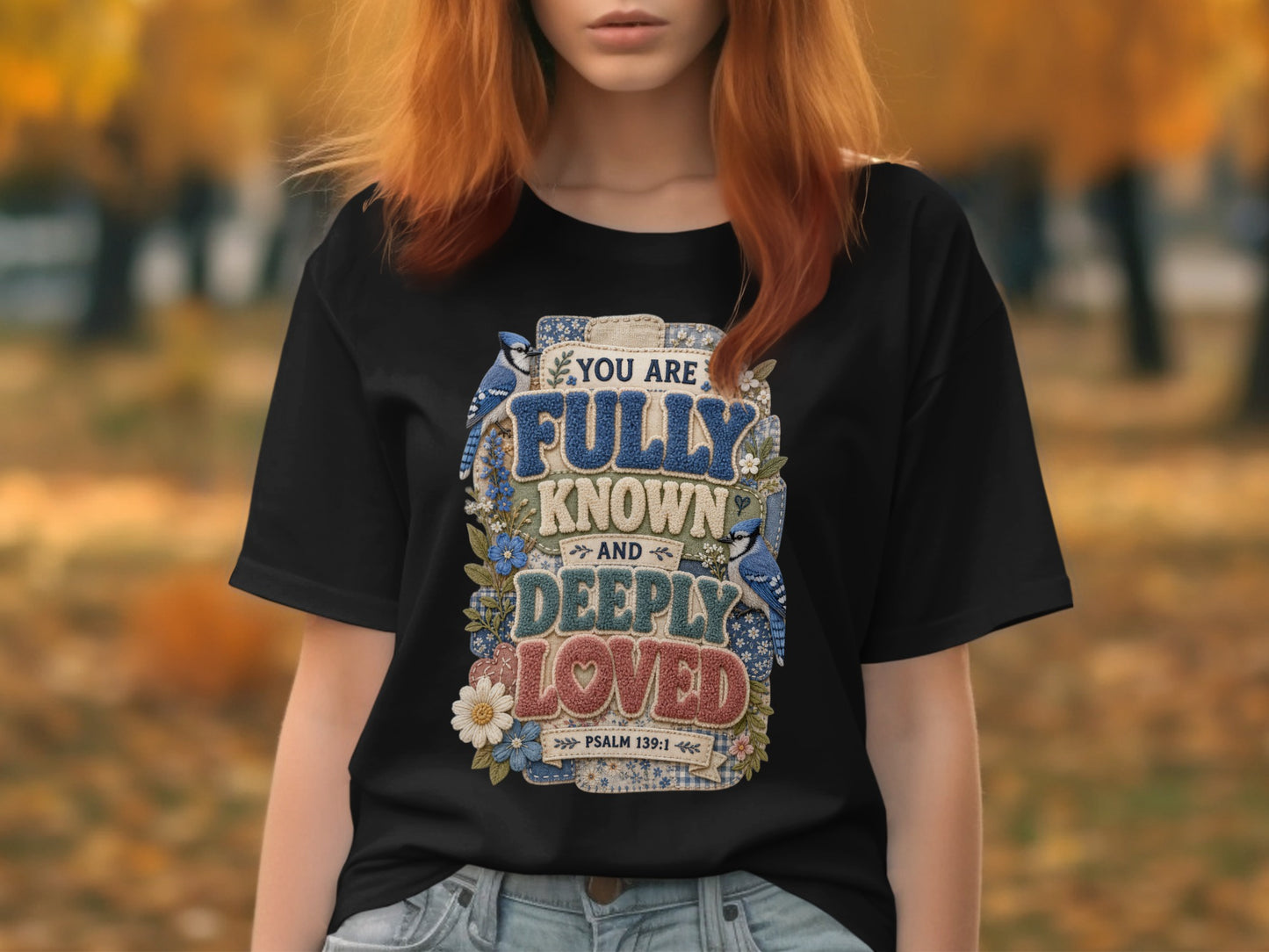 Black t-shirt with "You are fully known and deeply loved" text and blue jays.
