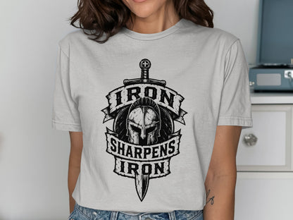 Shirt graphic with helmet, sword, and text "Iron Sharpens Iron".