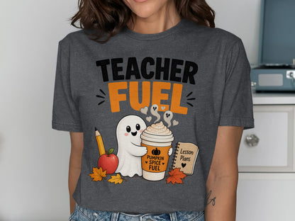 T-shirt with "Teacher Fuel" text, a ghost holding a pumpkin spice coffee, apple, pencil, and lesson plans.