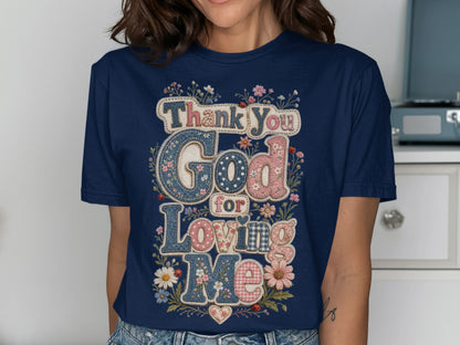 Navy t-shirt with "Thank You God for Loving Me" text and floral accents.