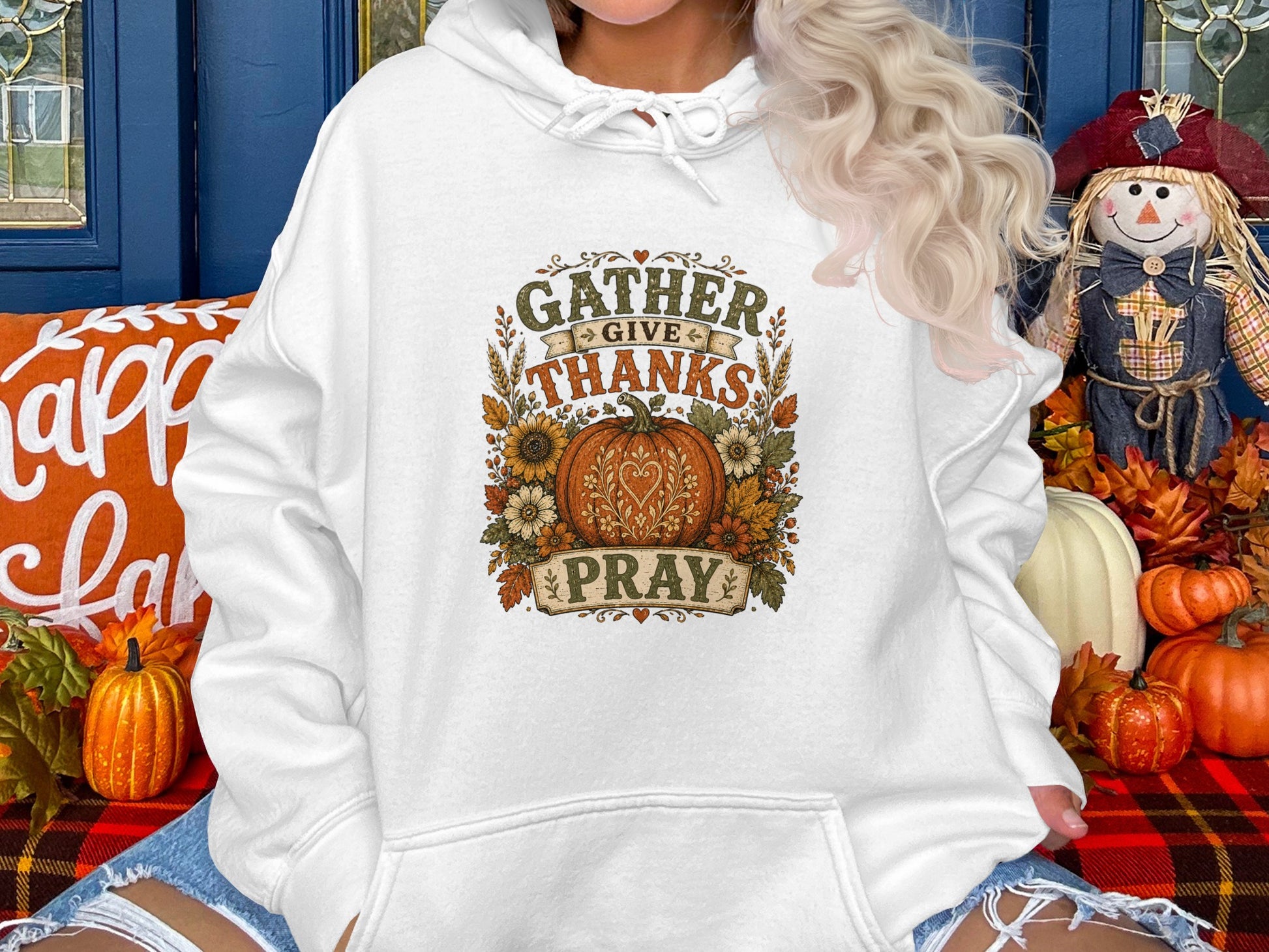 White hoodie with "Gather Give Thanks Pray" text and floral pumpkin graphic.