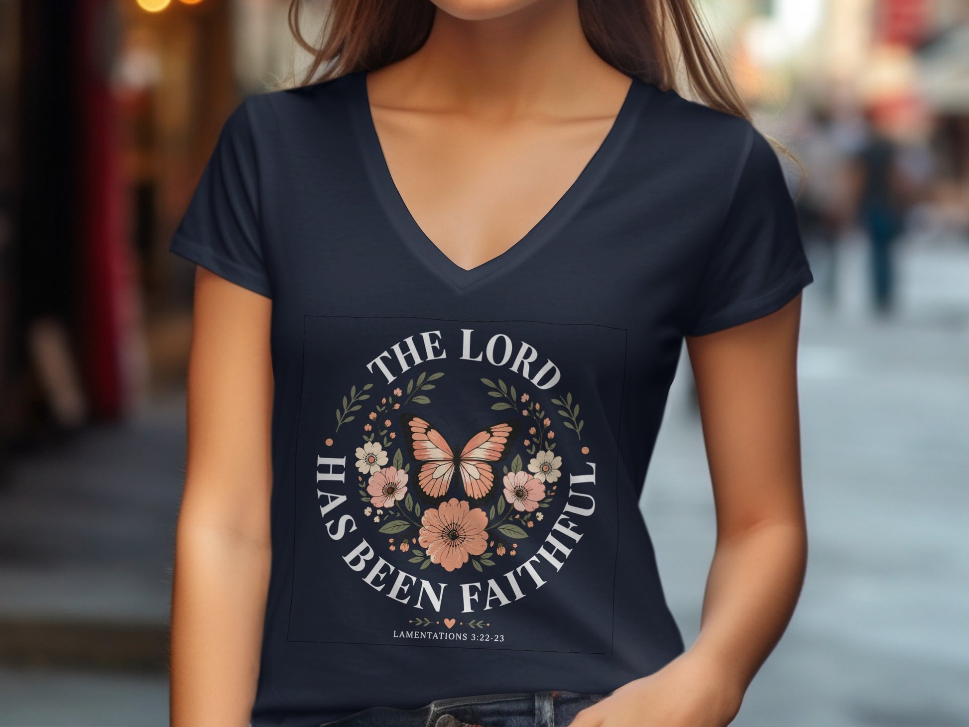 Dark t-shirt with "THE LORD HAS BEEN FAITHFUL" and floral wreath.