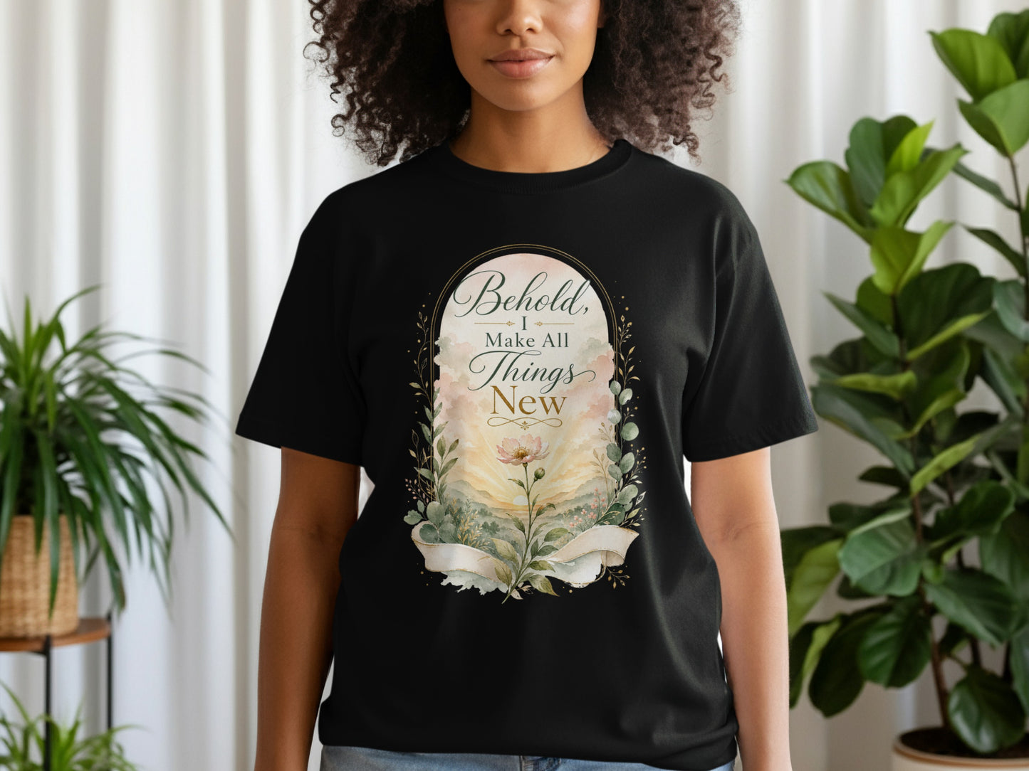 Black t-shirt with "Behold, I make all things new" text and floral design.
