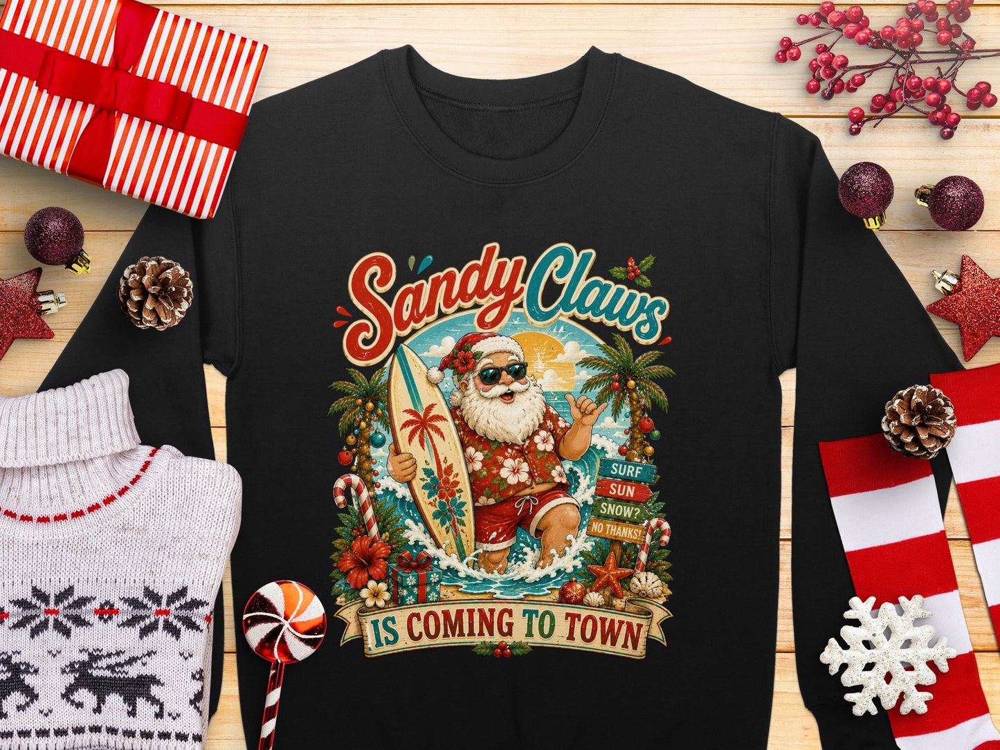 Santa Claus on a surfboard with "Sandy Claws is Coming to Town" text.