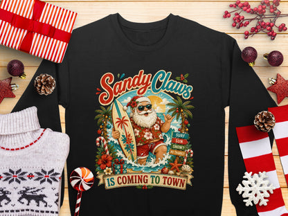 Santa Claus on a surfboard with "Sandy Claws is Coming to Town" text.