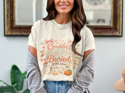 T-shirt graphic with "Couldn't Keep Him Buried" and "HE ROSE ANYWAY."