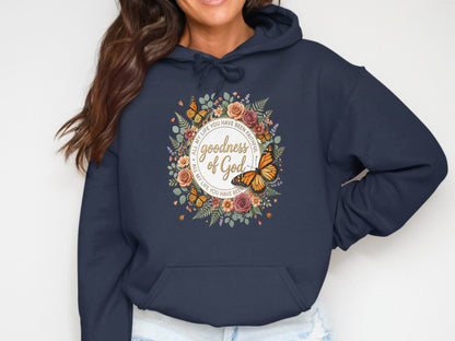 Navy hoodie with floral wreath and butterfly graphic with text.
