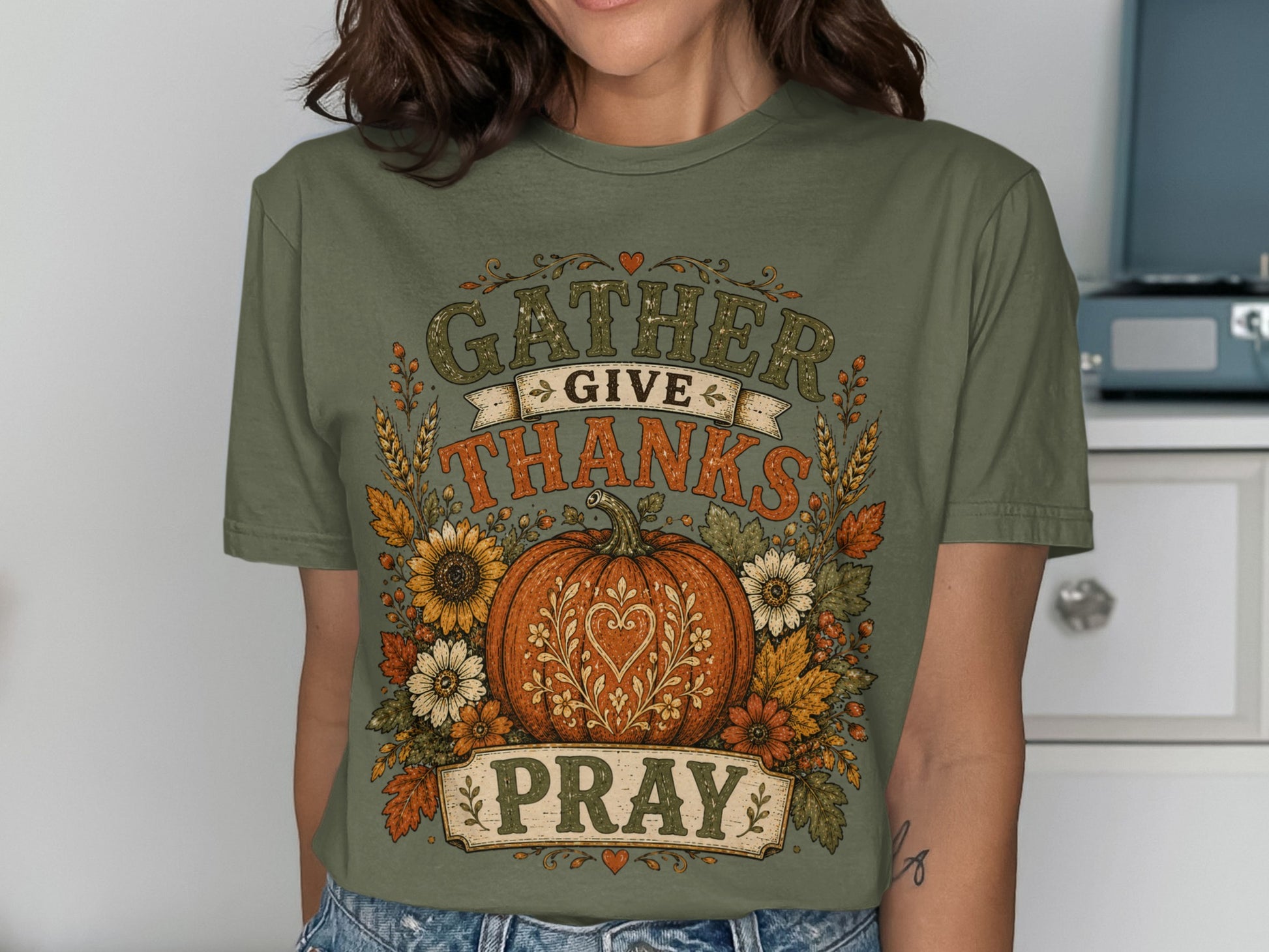 Green t-shirt with Thanksgiving design featuring pumpkin, sunflowers, and text.