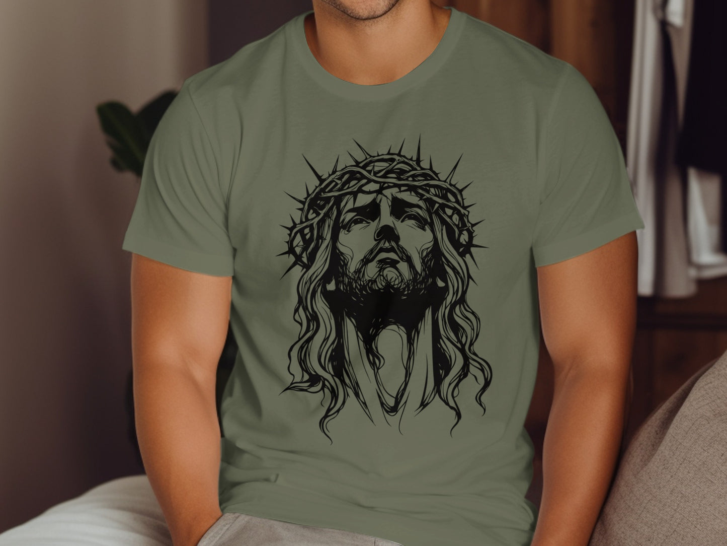 T-shirt with a black outline drawing of Jesus wearing a crown of thorns.