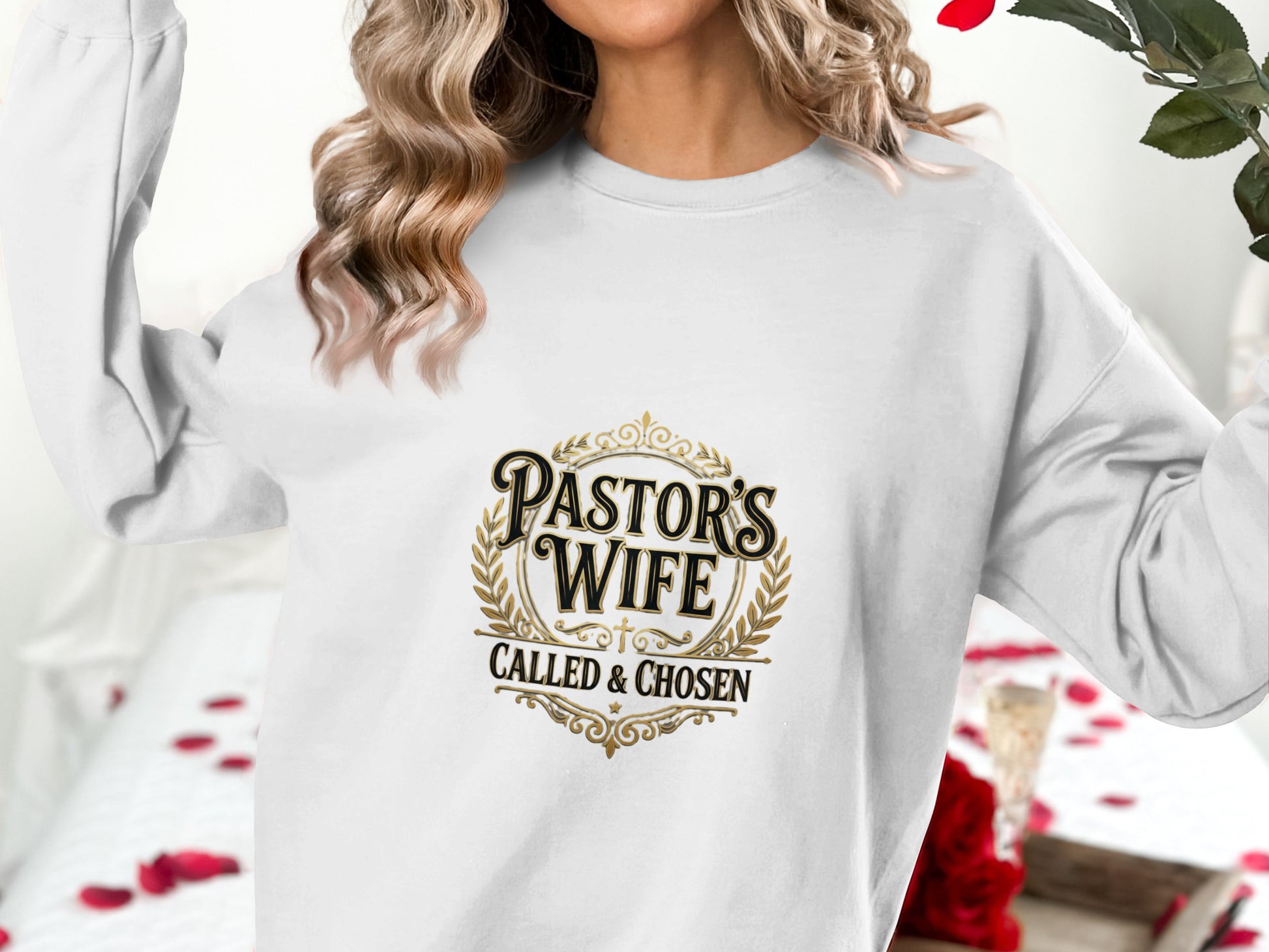 Crewneck sweatshirt with "Pastor's Wife Called & Chosen" text and ornate emblem.