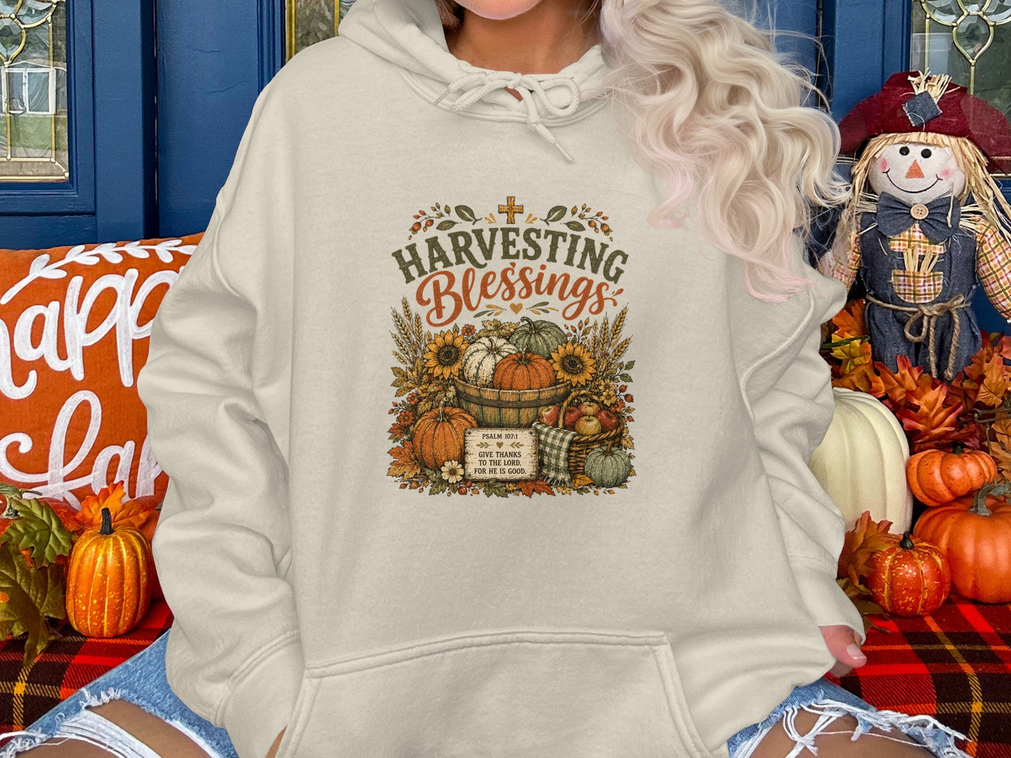 Cream hoodie with "Harvesting Blessings" and Psalm 107:1 graphic.