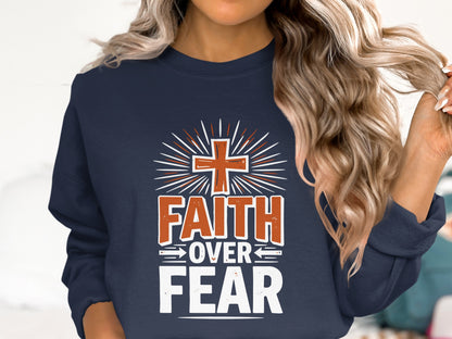 Navy sweatshirt with "Faith Over Fear" text and a cross design.