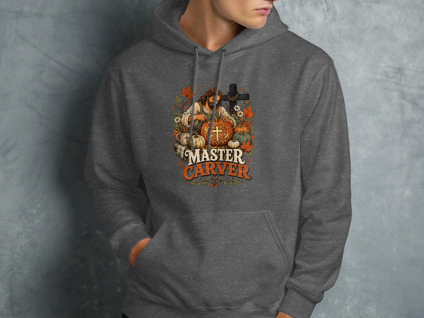 Gray hoodie with "MASTER CARVER" text and pumpkin and cross graphic.