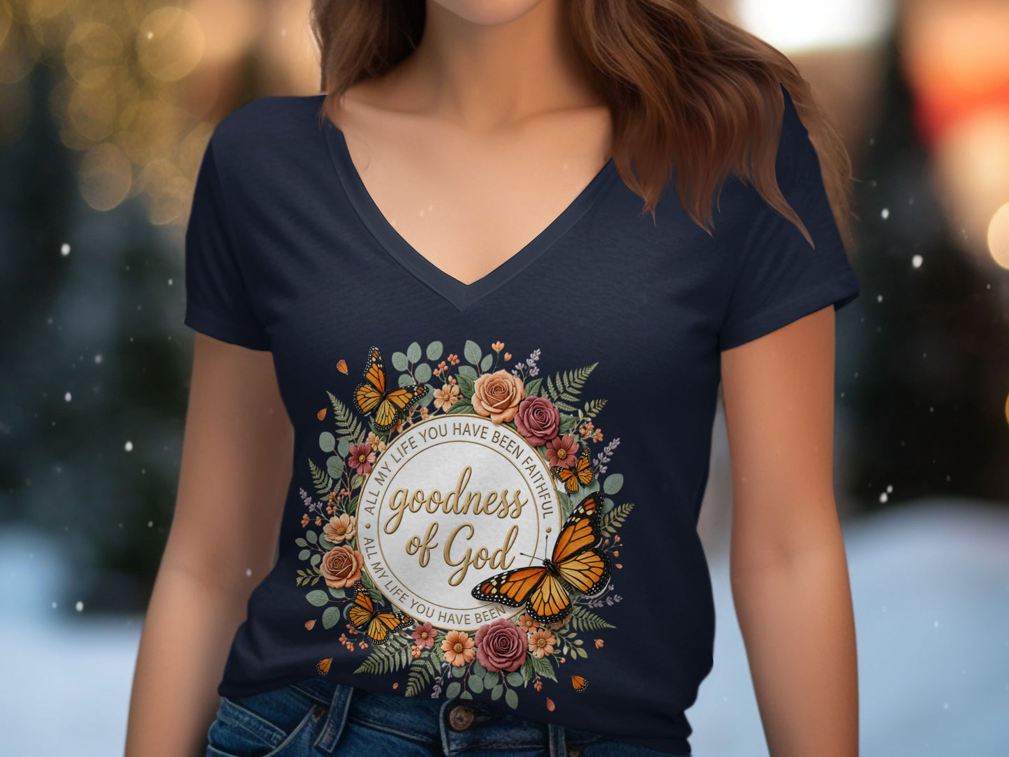 Navy v-neck t-shirt with "Goodness of God" text within a floral and butterfly wreath.