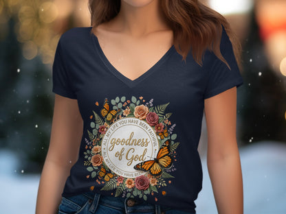Navy v-neck t-shirt with "Goodness of God" text within a floral and butterfly wreath.
