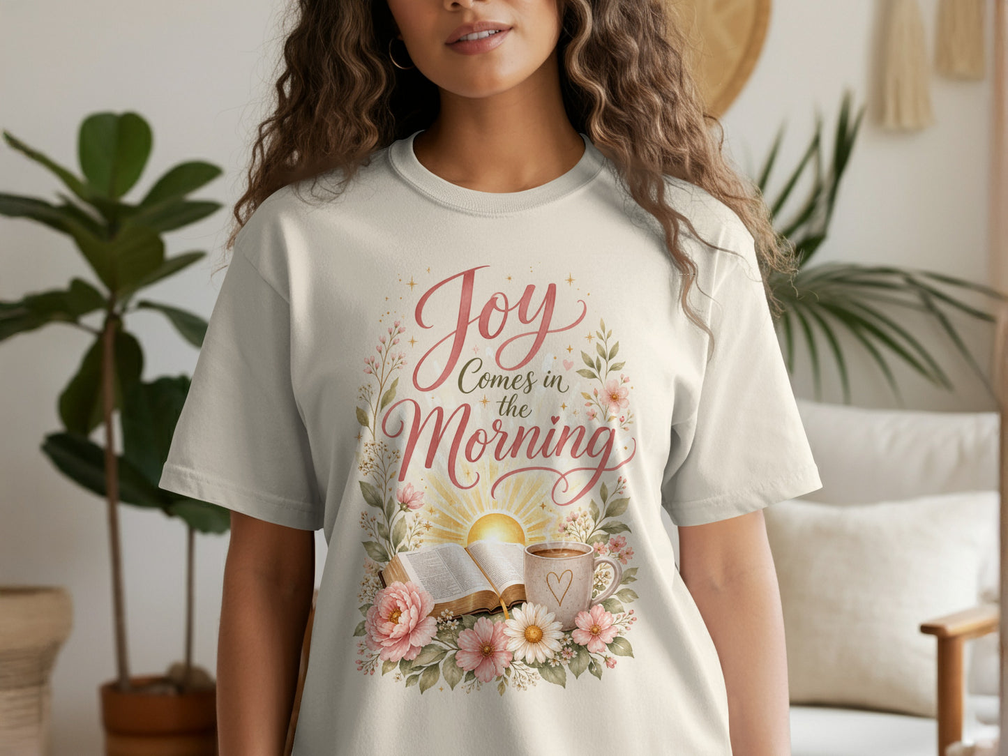 Cream t-shirt with "Joy Comes in the Morning" text, bible, and flowers.