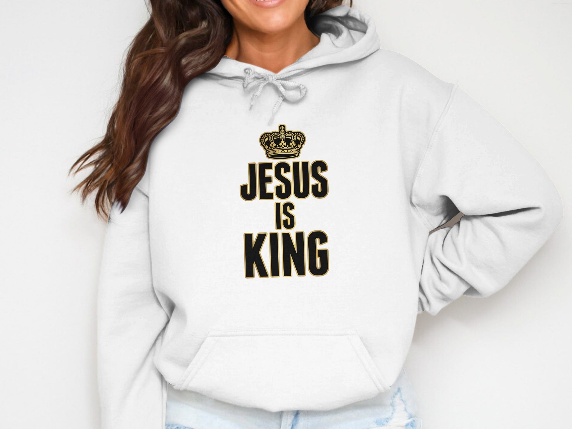 White hoodie with "JESUS IS KING" text and a gold crown graphic.