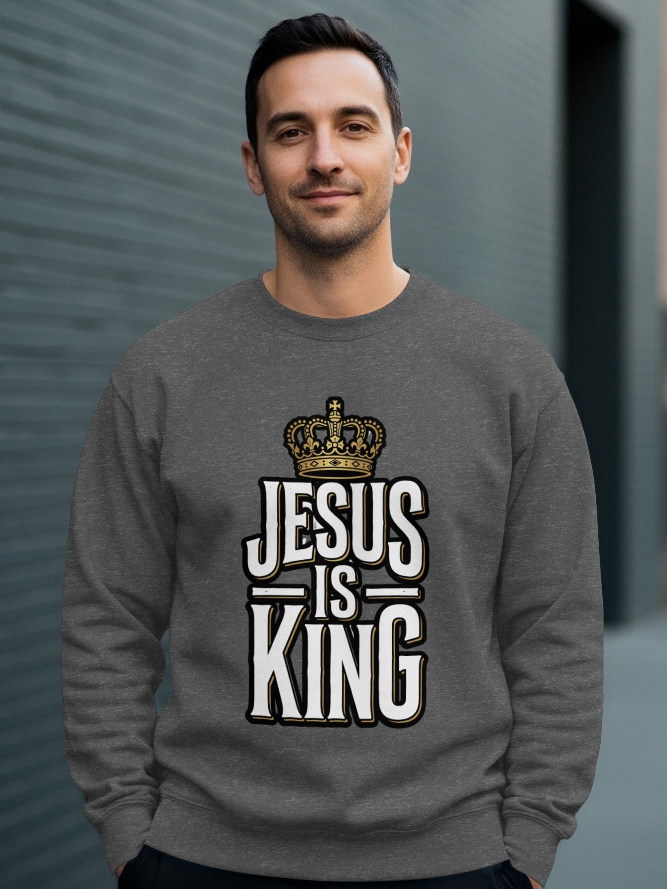 Dark grey sweatshirt with "Jesus is King" text and crown graphic.
