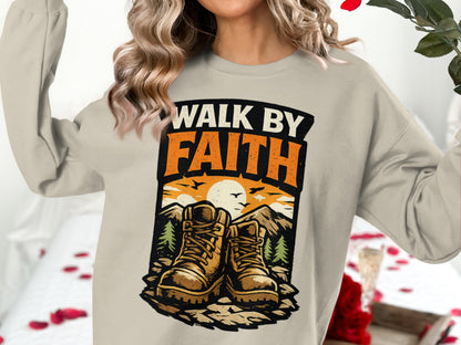 Lightweight graphic sweatshirt with "WALK BY FAITH" text and hiking boots landscape.