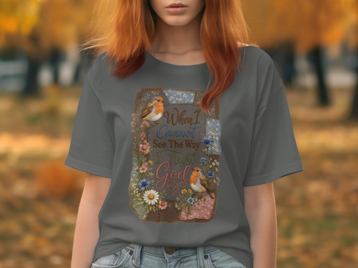 Grey t-shirt with floral and bird graphic and text "When I Cannot See The Way I Trust God".
