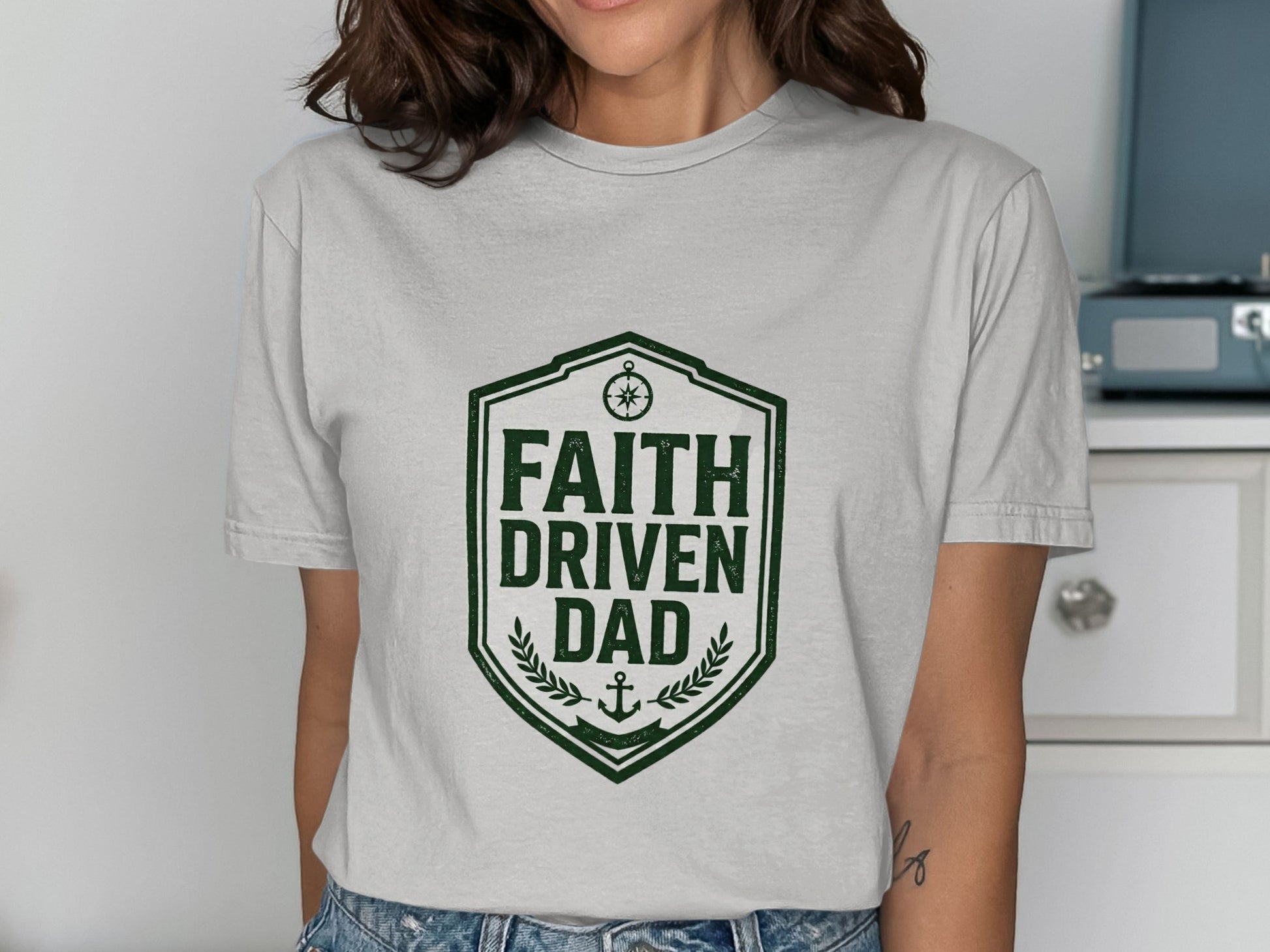 Grey t-shirt with green shield logo and "Faith Driven Dad" text.