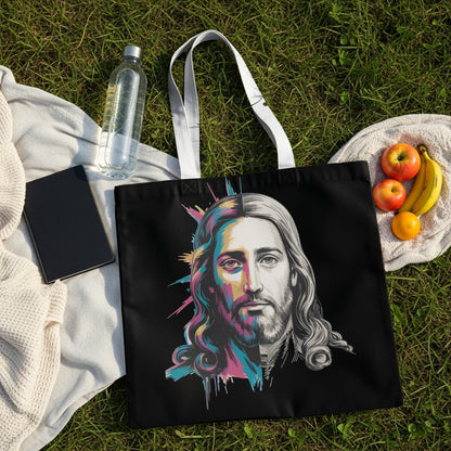 Black tote bag with a colorful portrait of Jesus, surrounded by picnic items.